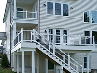 <b>Trex Composite deck & porch with white vinyl railing & black ballusters, facia board and wrapped beams & posts-2</b>